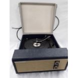 A vintage Fidelity solid State portable record player.