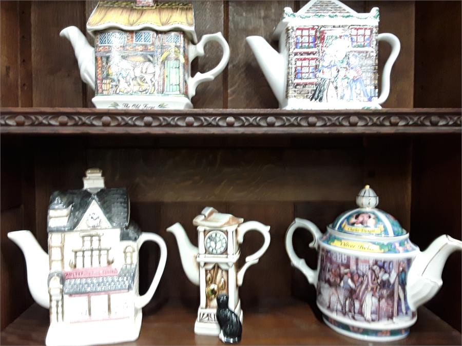 A quantity of collectable teapots.