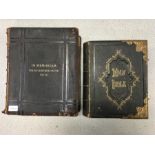 Two leather bound editions of the Bible.