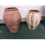 Two large terracotta pots.