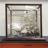 A diorama of two ships.