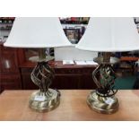 A pair of metal table lamps.