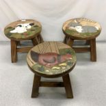 Three children’s stools, with a puppy, rabbit and chicken depicted on top.