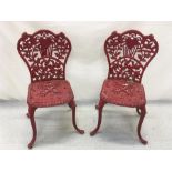 Two cast iron display chairs.