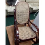 A rattan child's rocking chair.