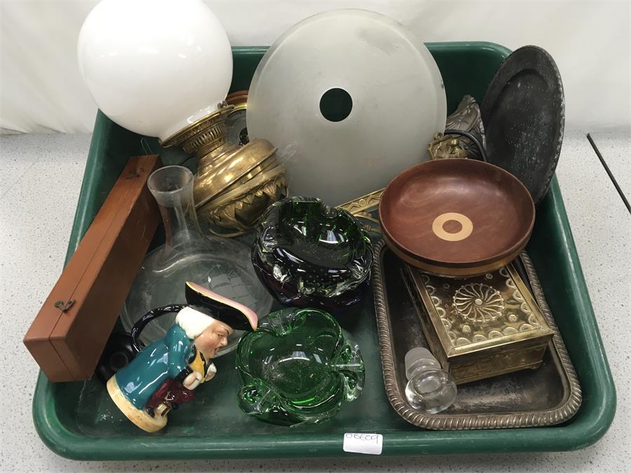 A box of mixed glass and metal items.