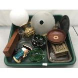 A box of mixed glass and metal items.