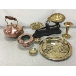 A set of scales, a kettle and other metal items.