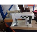 Two sewing machines, a Stitchmaster and an Alfa