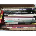 Two boxes of books, including many on Marilyn Monroe and a number of erotic editions.