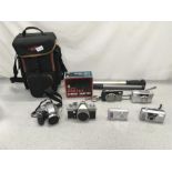 A small collection of cameras and accessories.