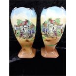 A pair of 1920's Beswick ware vases decorated with country scenes (damage).