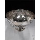 A large silver punch bowl embossed floral garlands resting on circular base Birmingham 1921 745