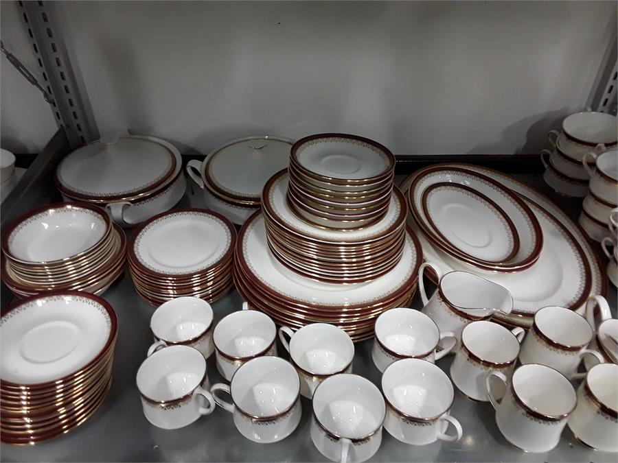 A large quantity of Paragon red and gold floral bordered dinner set.