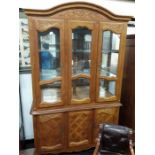 A modern oak China display cabinet with glazed top.