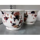 A pair of Coalport blue and rust floral decorated fern pots.