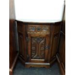 An old charm cabinet with one drawer and one cupboard.