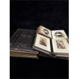 Four vintage black and white photo albums.