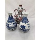 Three Chinese blue and white and rust floral decorated vases