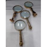 Four brass mounted magnifying glass