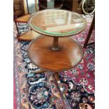 A two tier mahogany circular dumb waiter side table.