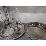 A plated silver tray, a pair of sterling silver and glass storm lights, silver mounted decanters ,