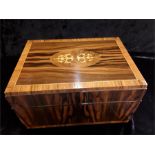 A modern Humidor cigar box in rose wood and satinwood veneer.