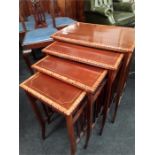 A nest of Victorian design mahogany and inlaid quartetto set of tables on slender legs