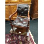 A 19th century child's mahogany deep buttoned leather high chair.