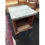 A small mahogany bedside cabinet with marble top.