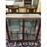 A small mahogany hardwood Oriental china display cabinet.