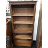 An old charm shelving unit with five shelves.