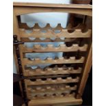 A pine wine rack for 35 bottles.