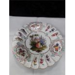 A meissen decorative plate painted figure fluted edge