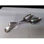 A pair of antique silver fiddle pattern table spoons