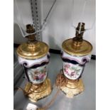 A pair of French gilt metal porcelain floral painted table lamps and shades Hallidays.