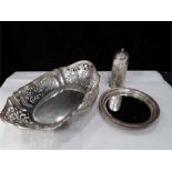 a Silver pieced and butterfly engraved oval basket 320 gram with a silver sugar caster and a silver