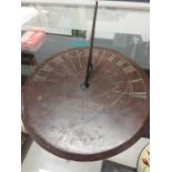 A Dolland and Sons brass sundial.