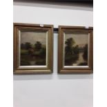 Two framed oil paintings of country/river scenes.