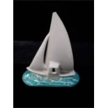 A Poole Pottery racing Yacht in blue and cream(damage)