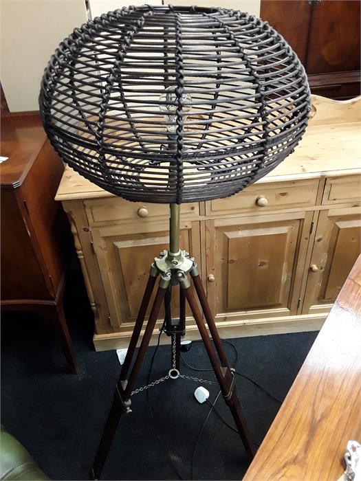 An unusual standard lamp on telescopic tripod base.