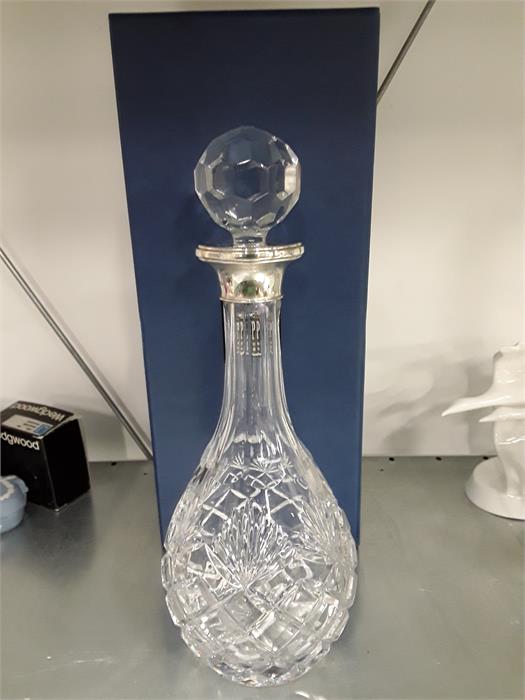 A boxed glass decanter in case.