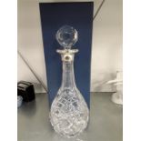 A boxed glass decanter in case.