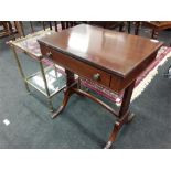 A mahogany side sofa table together with a glass and brass effect side table.