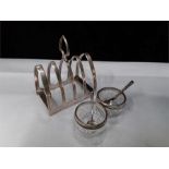 Silver 4 bar toast rack with a pair of silver and glass condiment pots