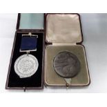 A bronze medallion for service National emergency May 1926 with a Eton college award cased