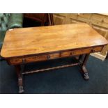 A Victorian rosewood veneered side table fitted 2 drawers resting on turned legs and under