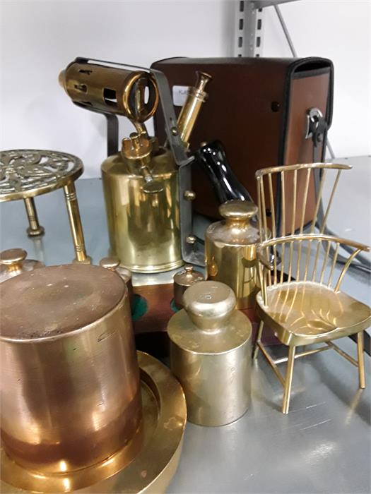 A quantity of brass ware to include paint stripper , trivet, weights, chair etc