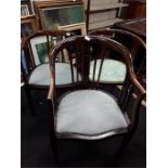 Three Victorian and later mahogany inlaid curved back hall chairs.