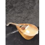 A mandolin. in inlaid case